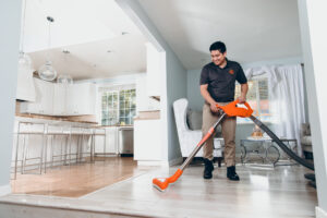 Water damage restoration vacuuming water - 911 Restoration in Oshkosh, WI